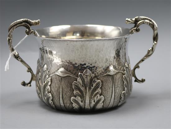 A late Victorian demi planished silver porringer by Nathan & Hayes, Birmingham, 1895, 8 oz.
